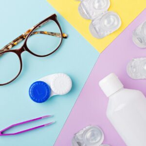 Contact lenses kit on multicolor background